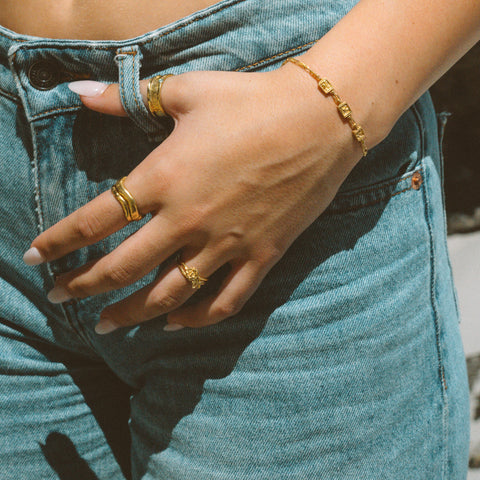 Petals ring in 24ct gold plate — worn with mixed gold rings and a bracelet