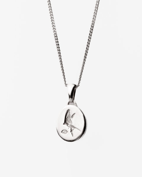 Family Pendant in sterling silver — front view on chain showing the swallow engraving