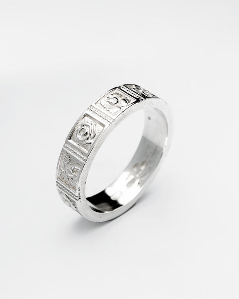Blossom ring in sterling silver — angled view of floral panels around the band