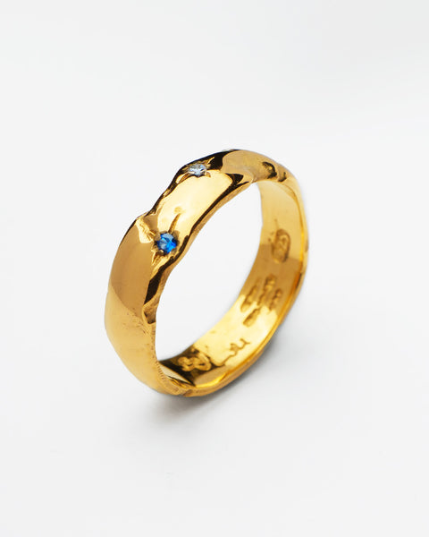 Coalesce ring in 24ct gold plate — angled view showing blue spinel and zirconia