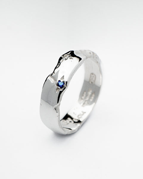 Coalesce ring in sterling silver — angled view showing blue spinel and zirconia