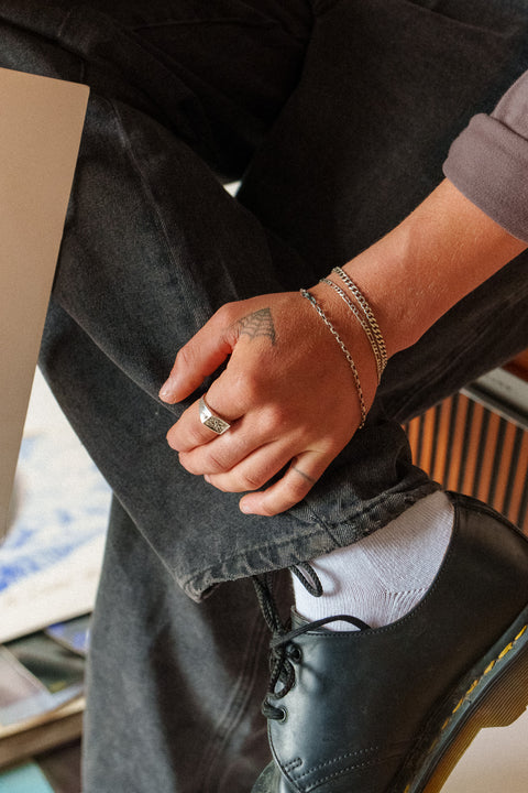Lou's Cuban in sterling silver — worn in a three-bracelet stack