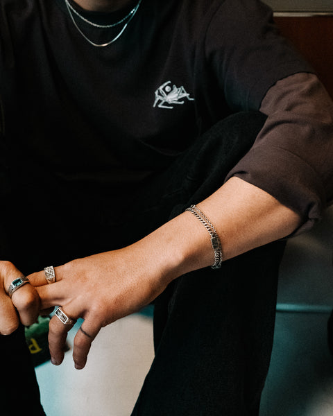Lou's Cuban in sterling silver — worn on the wrist with the clasp visible