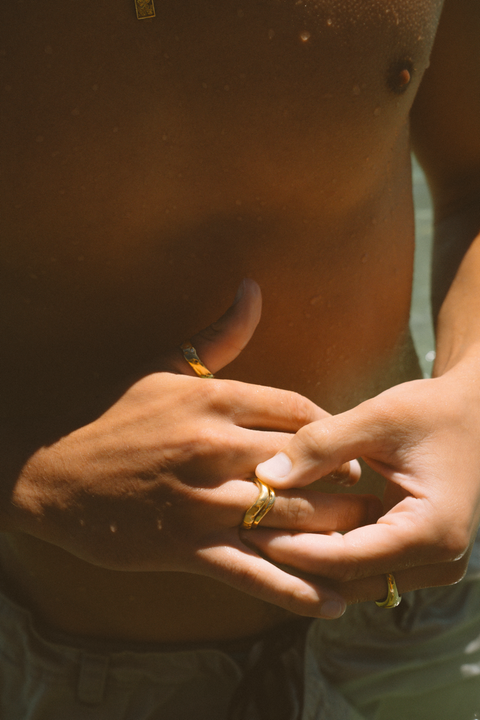 Serene Pair in 24ct gold plate — worn together while another hand adjusts the bands