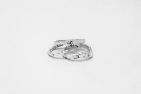 Serene I ring in sterling silver — displayed with two other silver bands