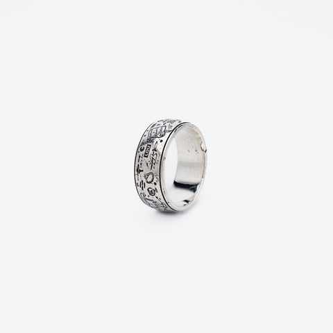 The Grad Ring in sterling silver — upright left-side view of the engraved band