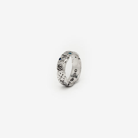 Lou's Grad Ring in sterling silver — angled product view with two blue gemstones visible