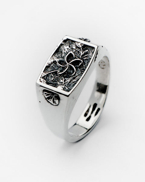 Nascence frangipani ring in sterling silver — angled front view of the sculpted flower