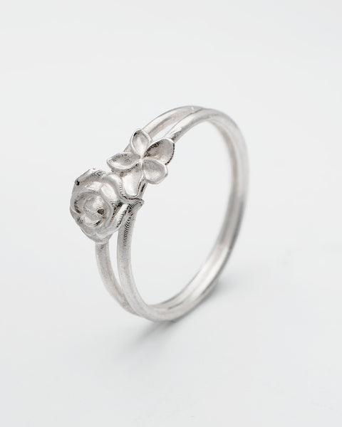 Petals ring in sterling silver — angled view of the sculpted rose and petal details