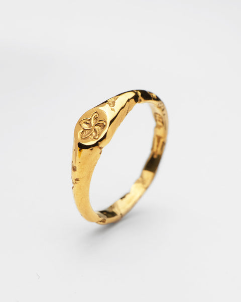 Plumeria ring in 24ct gold plate — angled view of the frangipani motif and organic band