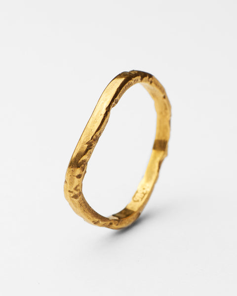 Serene I ring in 24ct gold plate — angled view of the slim organic band