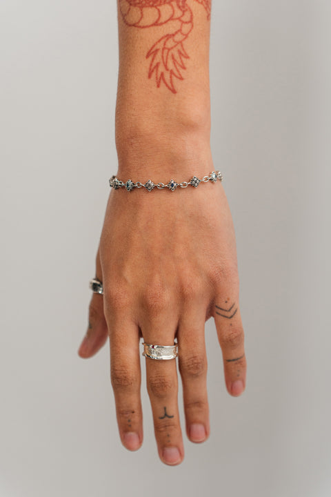 Vivid ring in sterling silver — worn with another silver ring and silver bracelet