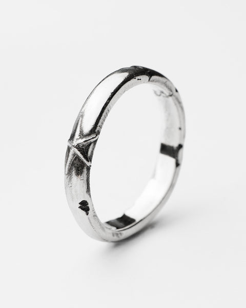 Stellar ring in sterling silver — angled view of the slim band and star detail