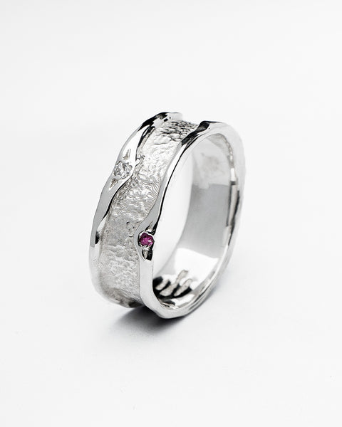 Vivid ring in sterling silver — angled view of the ruby, zirconia and textured band